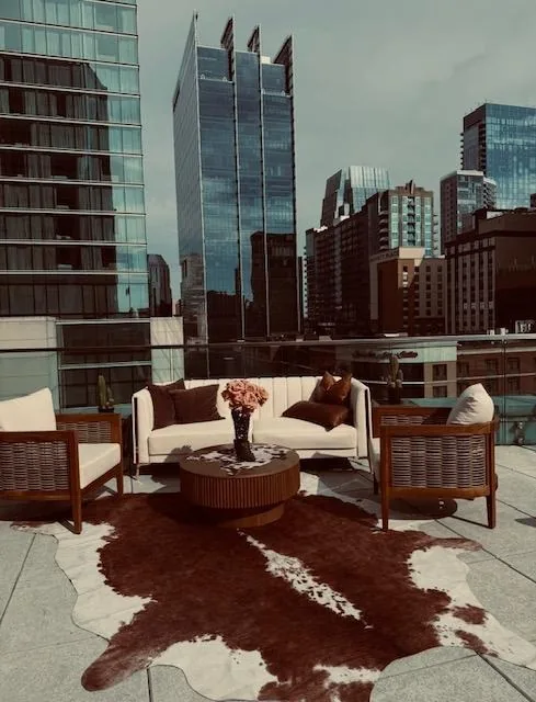 VIP buyer lounge with a cowhide rug on a Nashville rooftop